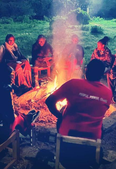 Activists gathered around a bon fire at the Global Platform in Kenya
