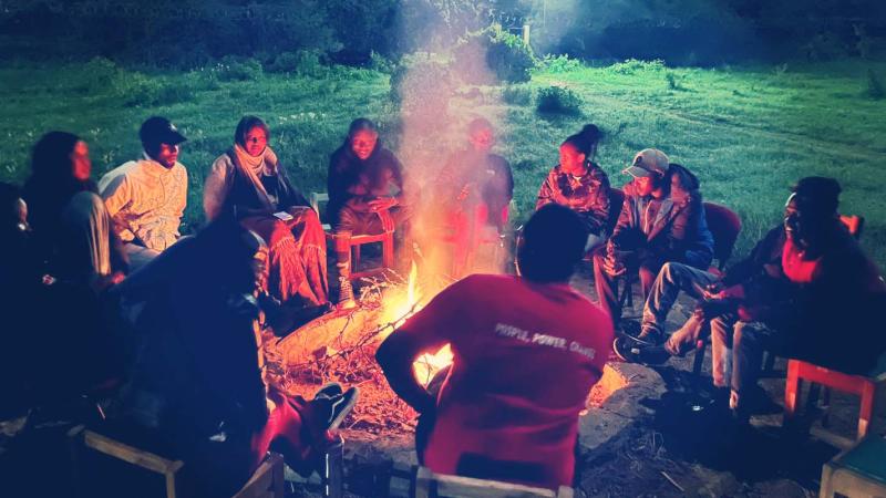Activists gathered around a bon fire at the Global Platform in Kenya