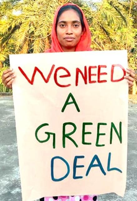 Protester with Green Deal sign