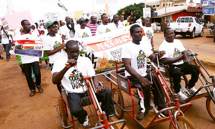 Peaceful elections campaigners on bike